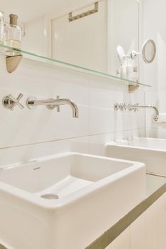 Elegant bathroom with two washbasins and a large mirror
