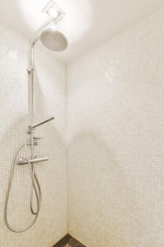 Modern shower stall in a bright bathroom