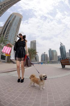 beautiful woman goes in shopping in the city