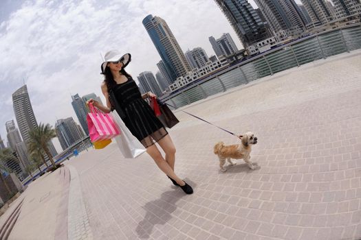 beautiful woman goes in shopping in the city