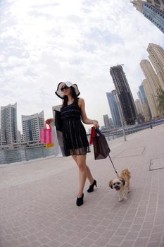 beautiful woman goes in shopping in the city