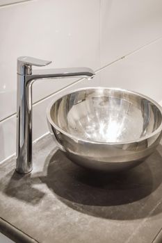 Close up of luxury faucet in an elegant bathroom