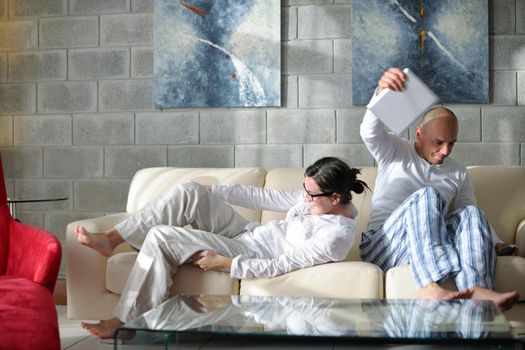 happy young  Couple Using Digital Tablet computer At Home