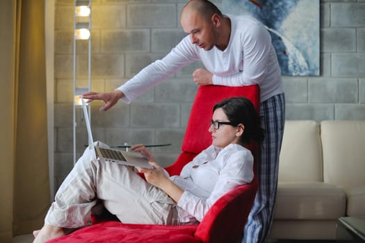 happy young  Couple Using Laptop computer At Home