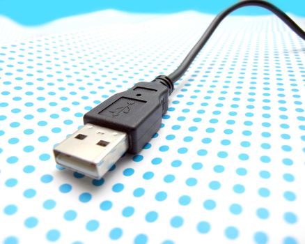 usb cable on dotted background