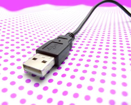 usb cable on dotted background