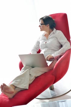 woman working on laptop computer and relax at modern home