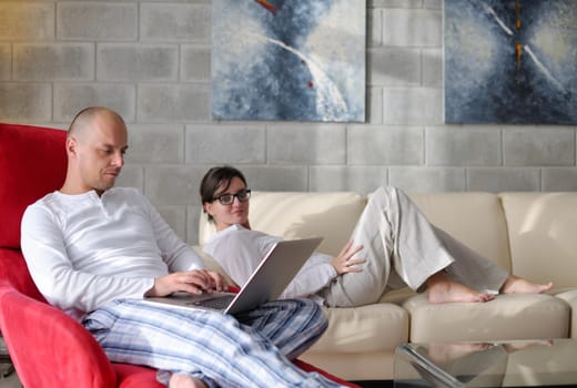 happy young  Couple Using Laptop computer At Home