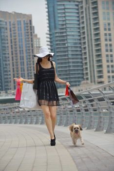 beautiful woman goes in shopping in the city