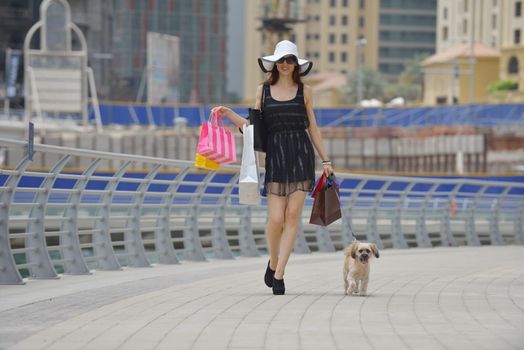 beautiful woman goes in shopping in the city