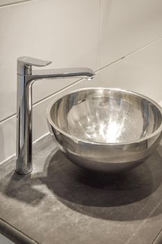 Close up of luxury faucet in an elegant bathroom