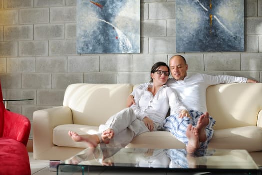 happy young couple relax at modern home living room indoor