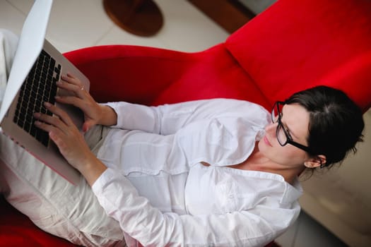 woman working on laptop computer and relax at modern home