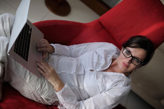 young beautiful woman using a laptop computer at home