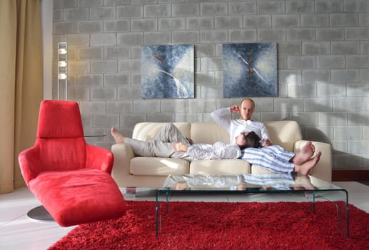 happy young couple relax at modern home living room indoor