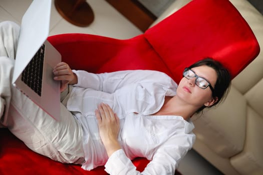 woman working on laptop computer and relax at modern home