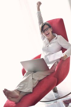 young beautiful woman using a laptop computer at home