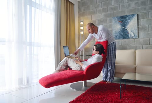 happy young  Couple Using Laptop computer At Home