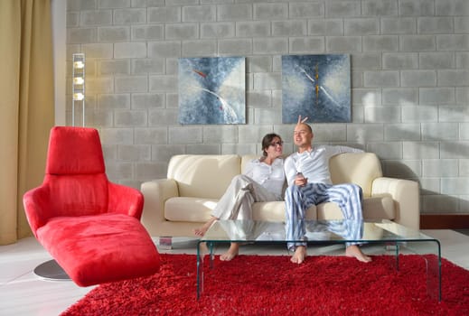 happy young couple relax at modern home living room indoor