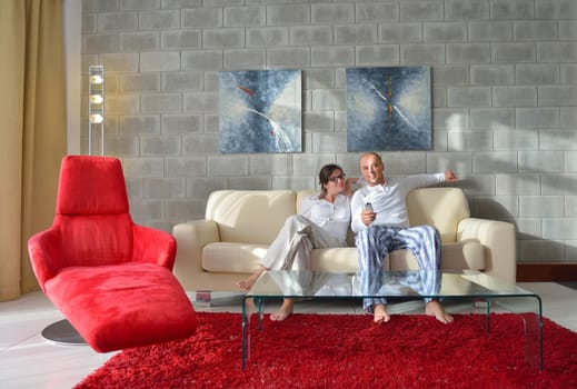 happy young couple relax at modern home living room indoor