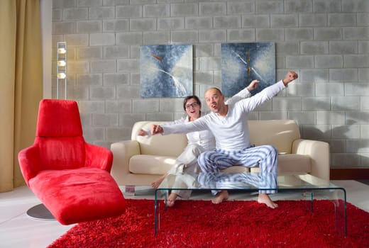 happy young couple relax at modern home living room indoor