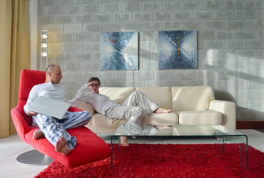 happy young couple relax at modern home living room indoor