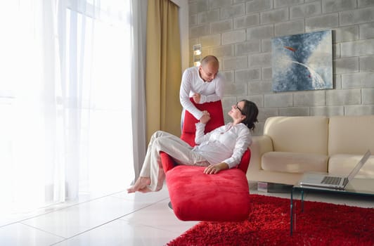 happy young couple relax at modern home living room indoor