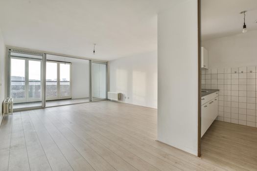 A bright room with large windows on the entire wall