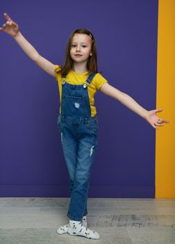 Cute little girl dancing ballet at home