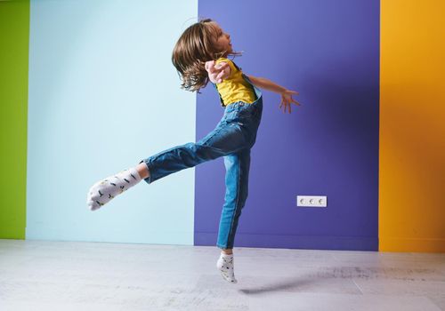 Cute little girl dancing ballet at home