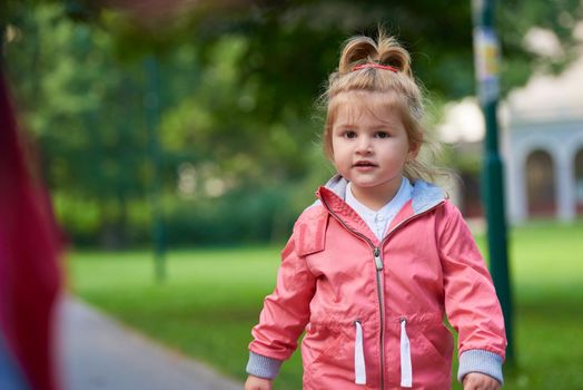 happy  little girl have fun in park