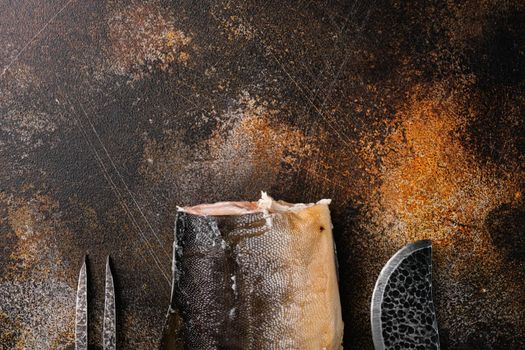Whole hot smoked fish set, on old dark rustic table background, top view flat lay, with copy space for text