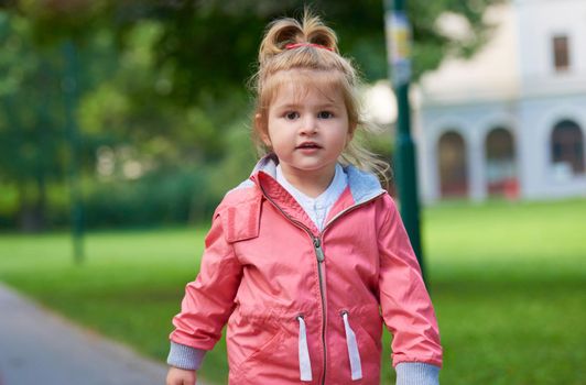 happy  little girl have fun in park