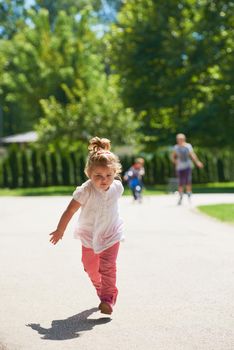 happy  little girl have fun in park