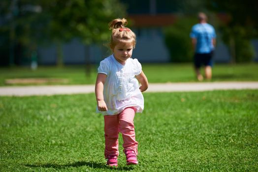 happy  little girl have fun in park