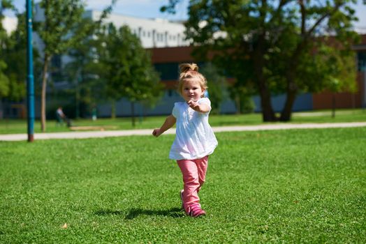 happy  little girl have fun in park