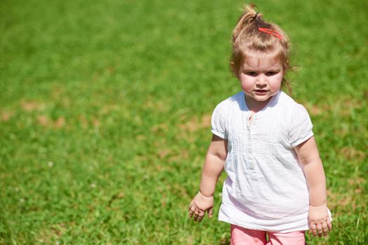 happy  little girl have fun in park