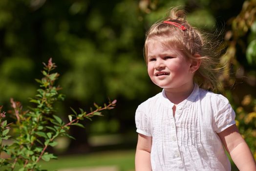 happy  little girl have fun in park