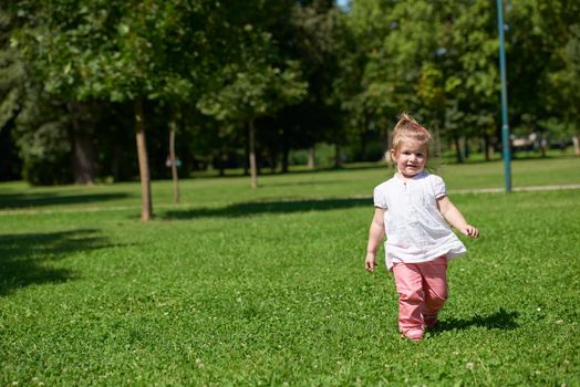 happy  little girl have fun in park