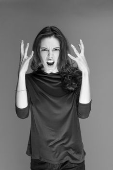 beautiful young brunette woman in a red blouse posing and expresses different emotions. close-up portret