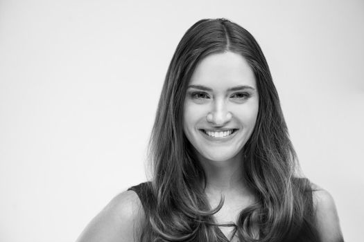 beautiful young brunette woman in a gray dress posing and expresses different emotions. close-up portret