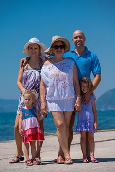 Portrait of happy multi generation family holding their hands while standing on the beach coast during Summer vacation Healthy family lifestyle concept