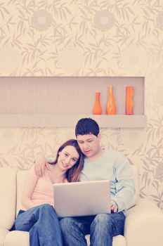 young couple at home with  modern livingroom indoor working on laptop on house finance and planing