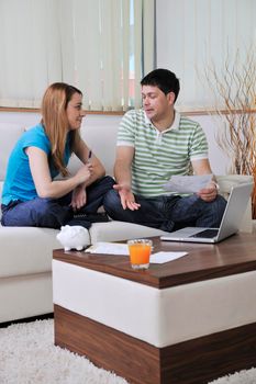 young couple at home with  modern livingroom indoor working on laptop on house finance and planing