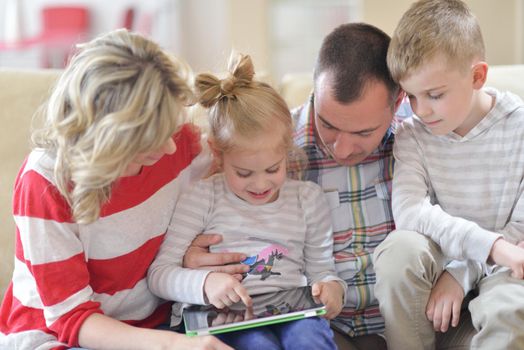 hapy young family have fun  with their children at modern living room home indoors