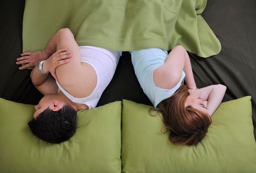 happy young couple in bed at morning