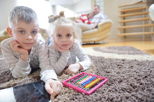 hapy young family have fun  with their children at modern living room home indoors