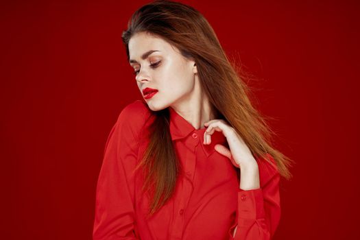 woman with red hair fashion posing red shirt glamor. High quality photo