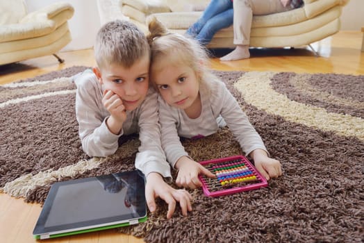 hapy young family have fun  with their children at modern living room home indoors