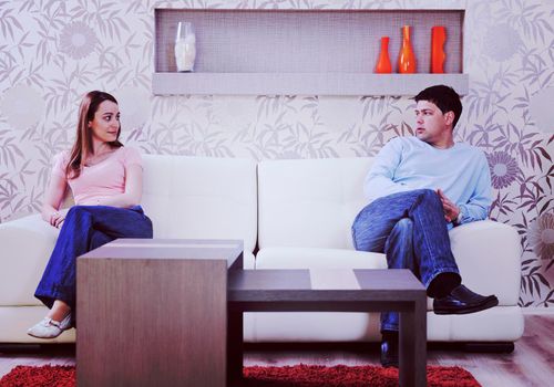 happy young couple relax at home in modern and bright living room 